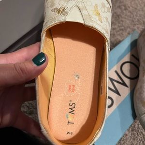 Tom’s, cute gold bumblebee shoes, size 8, worn once maybe twice.